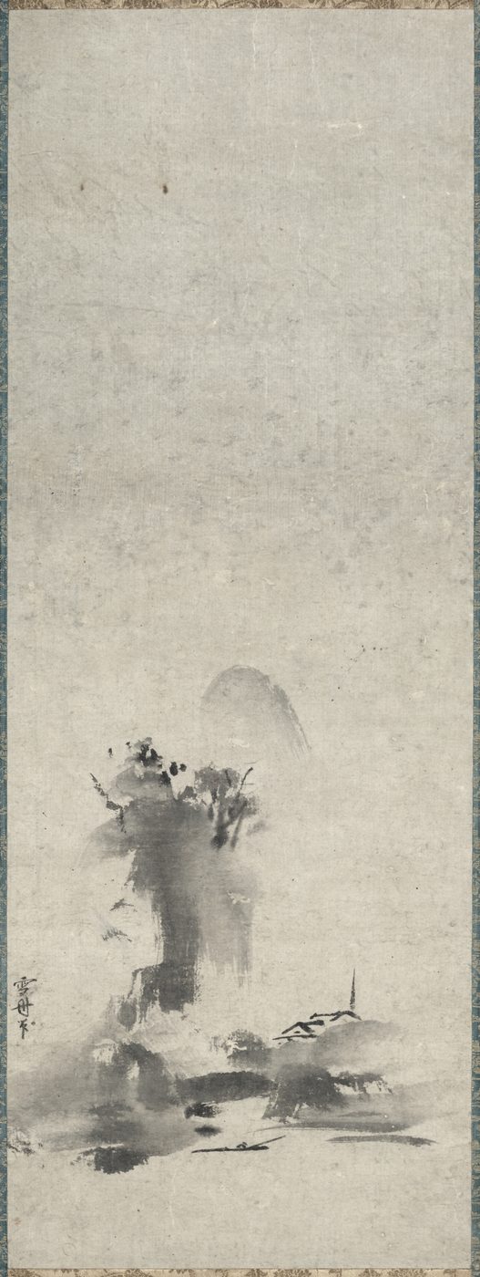 A tall, narrow hanging scroll of ink on paper showing a misty landscape painted in loose, wet washes, with a small hut and trees emerging from pale grey and black ink, and a column of inscriptions above.